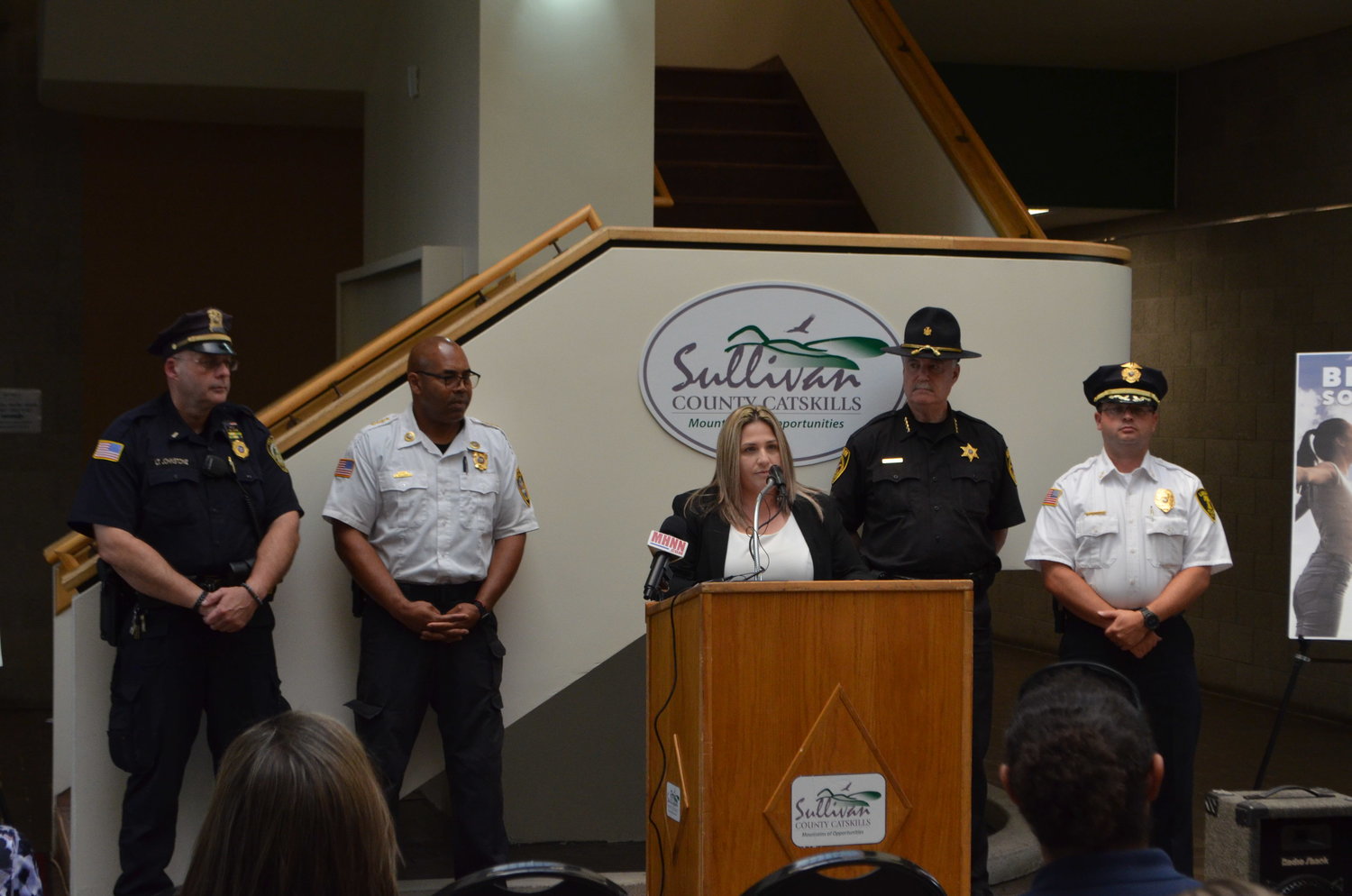 Sullivan County District Attorney Meagan Galligan describes the path to treatment offered by Hope Not Handcuffs, flanked by members of Sullivan County Law Enforcement.